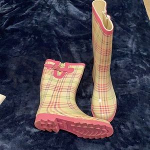 Pink plaid rain boots.